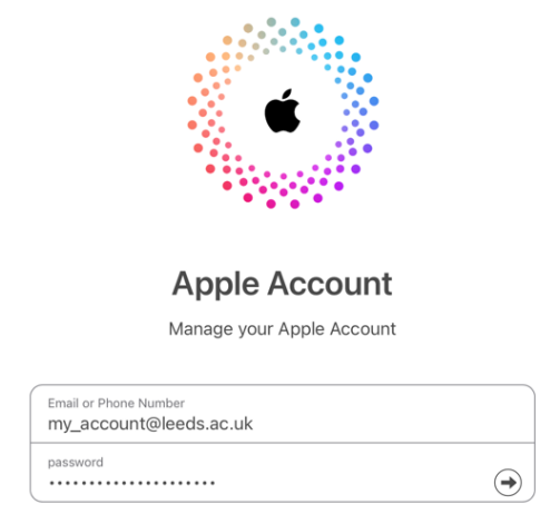 Apple Account login screen with email and password fields filled in.